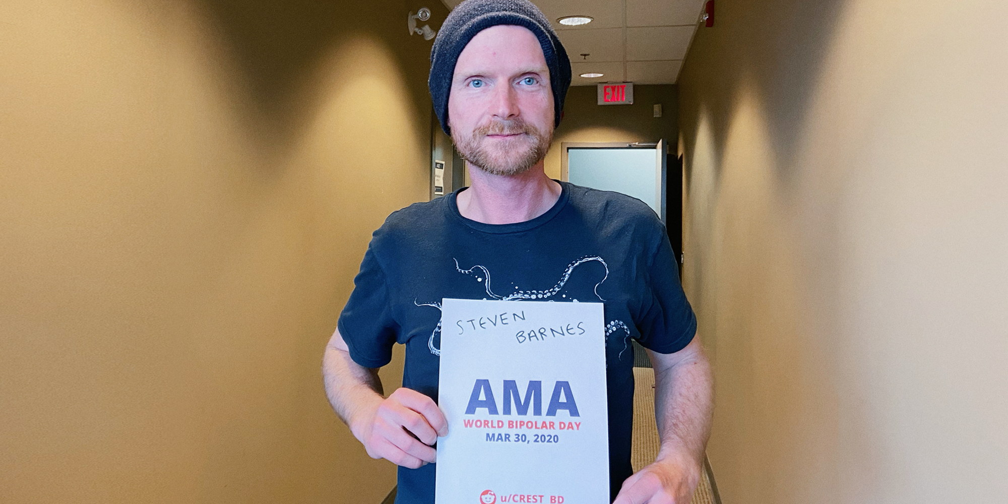 Dr. Barnes holding a sign proving he will be involved in the bipolar ama.